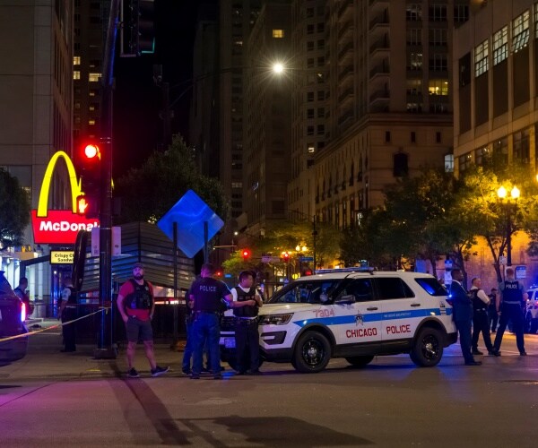 chicago police work at the scene of a shooting