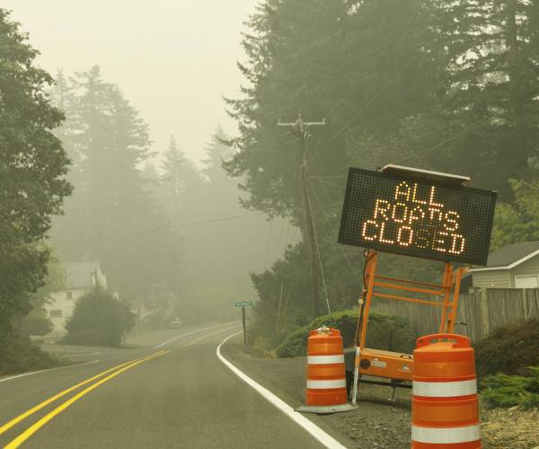 a road sign reading all roads closed