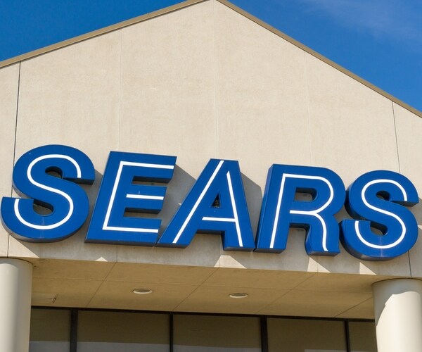 sears corporate logo symbol emblem on building sign side