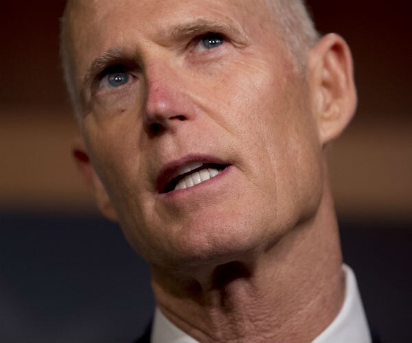 sen. rick scott talking to reporters on capitol hill in washington