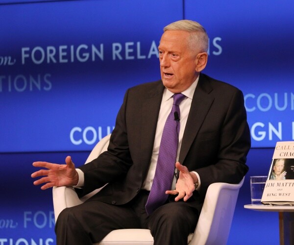 mattis in a black suit and purple tie at a cfr event