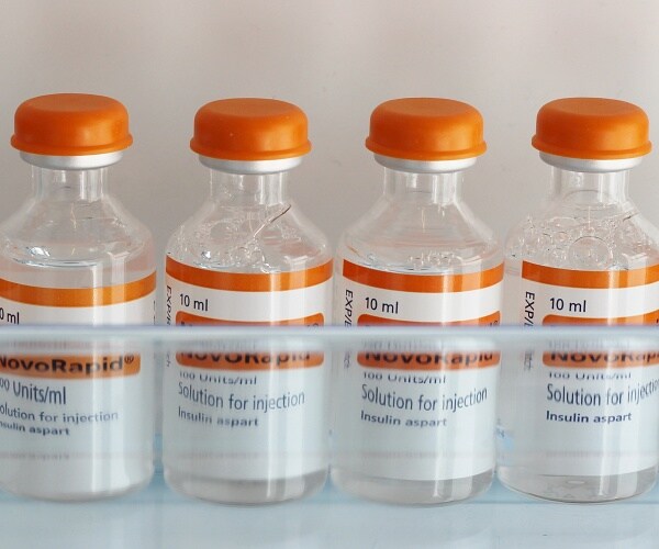 bottles of insulin on fridge shelf