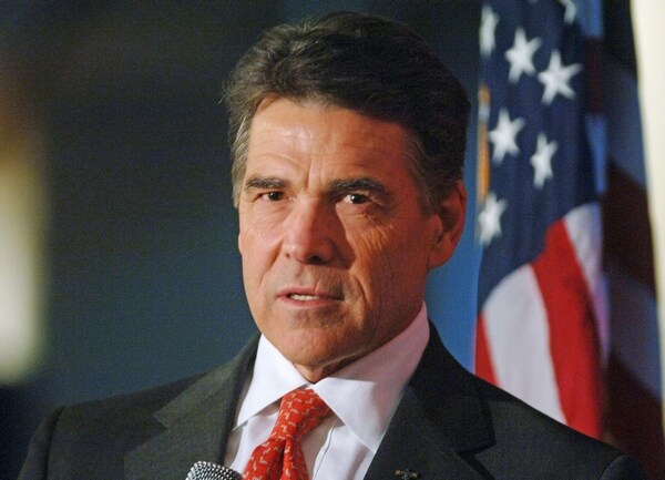 Perry, Under Fire, Cuts Europe Trip Short to Deal With Ebola 