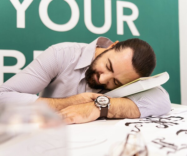 a man napping at his desk