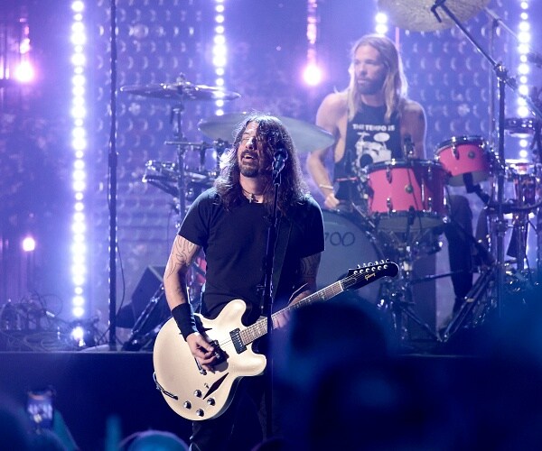 dave grohl plays guitar onstage