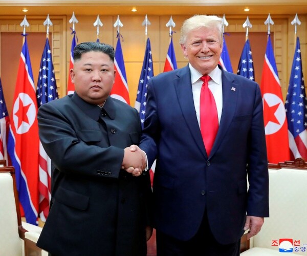 kim jong un and donald trump shake hands