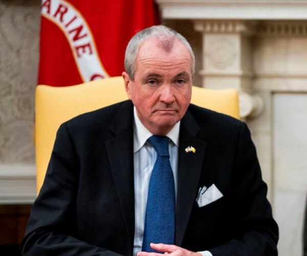 phily murphy sits in chair