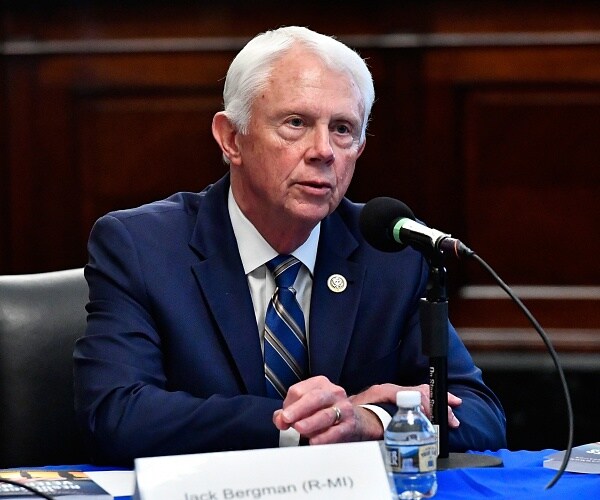 jack bergman speaks into mic