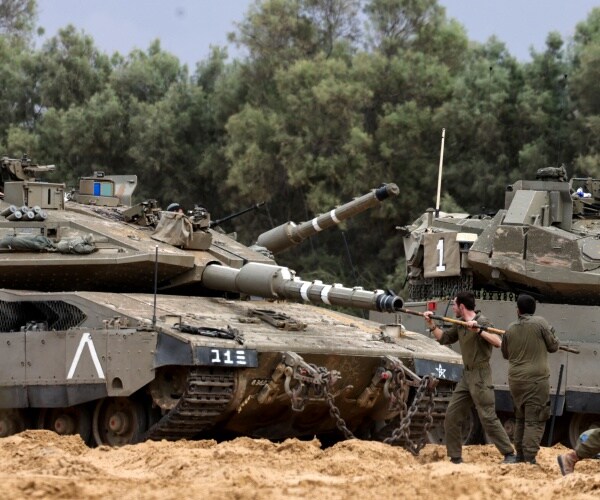 Prime Minister Benjamin Netanyahu's security cabinet voted to scale up the offensive against the Pal...