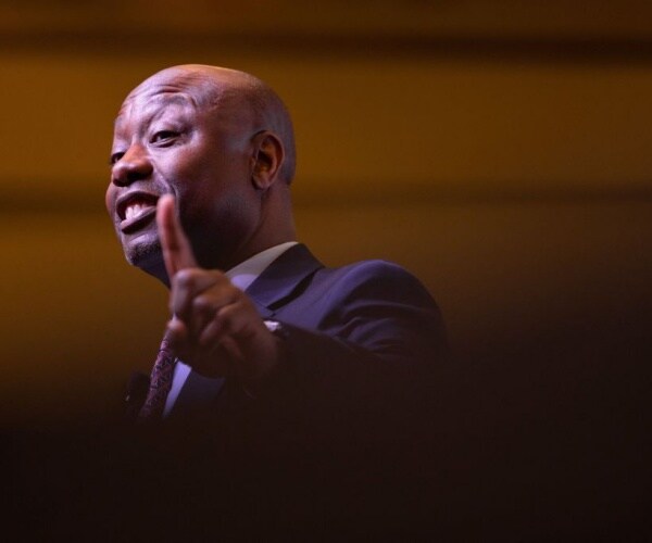 closeup of tim scott in suit and tie and smiling