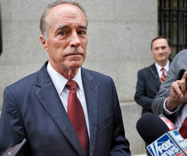chris collins stands outside a courthouse