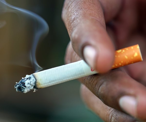 Smoker holding a cigarette.