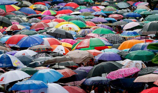 Filipinos Clean Graves, Pray, Honor Dead on All Saints' Day