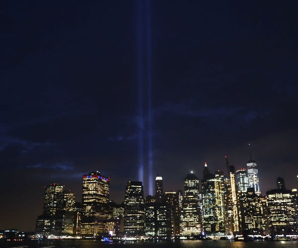 the nine eleven memorial lights on the new york skyline