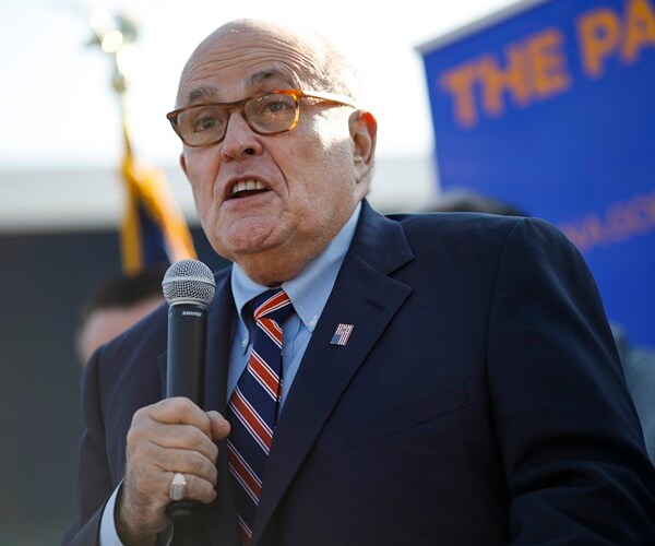 rudy giuliani speaks to a group