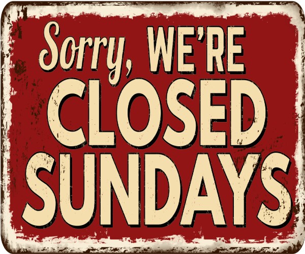 a store sign reading sorry we are closed on sundays