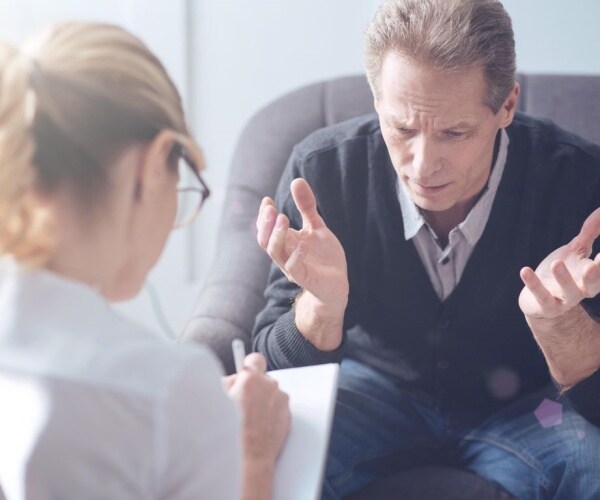 Man talking to therapist