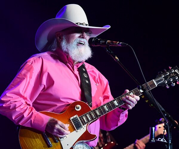 charlie daniels plays guitar on stage