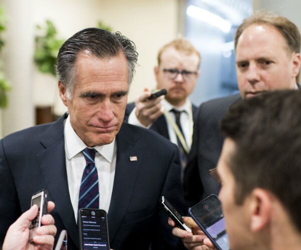 sen. mitt romney, R-Utah talks to reporters on capitol hill.