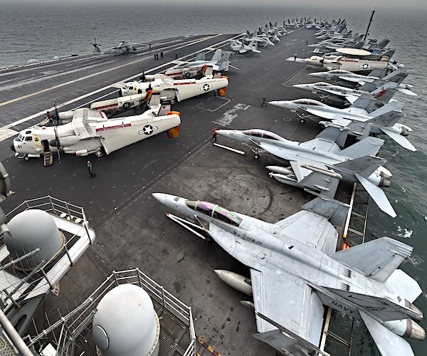 The deck of the USS Roosevelt with planes stacked up