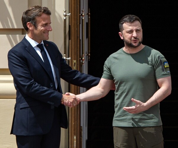 volodymyr zelenskyy shakes hands with emmanuel macron

