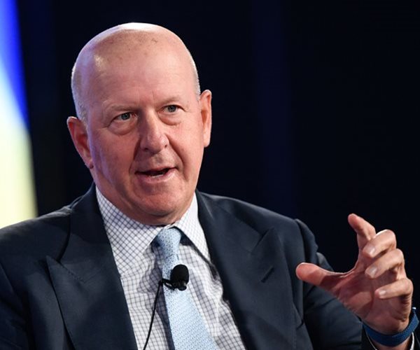 Goldman Slashes CEO's Pay to $25 Million