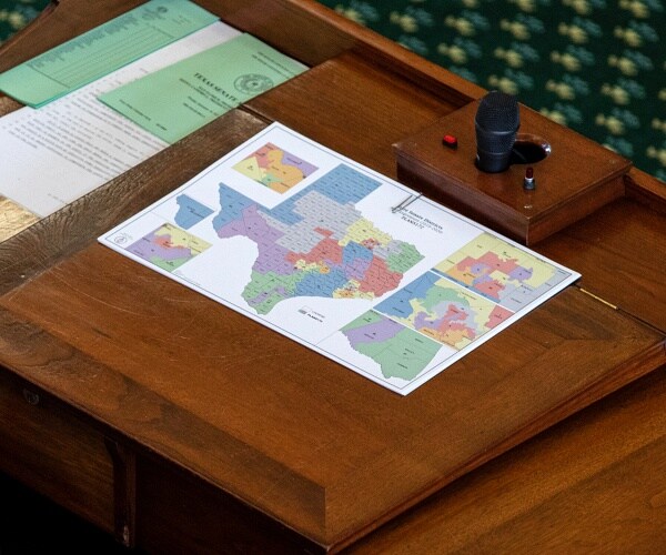 map of texas sits on desk
