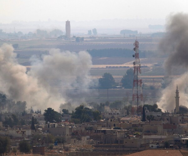 Smoke rises from a Turkish military strike on a Syrian target