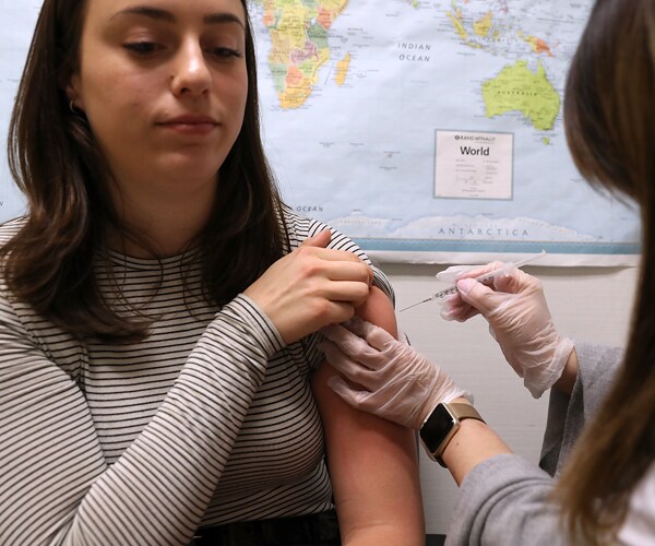 A patient receives a flu shot