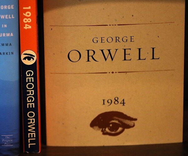 george orwell's novel 1984 with eye in black is displayed with some of his other works