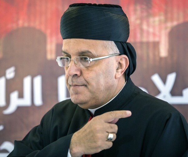 maronite archbishop moussa el-hage gestures during a press conference
