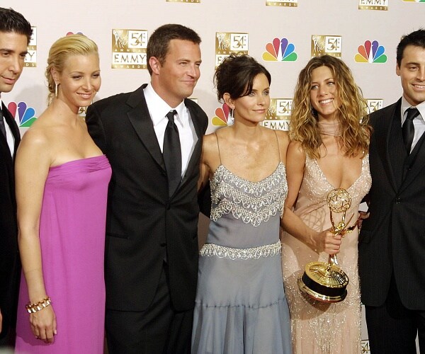 friends cast stand on red carpet after winning emmy