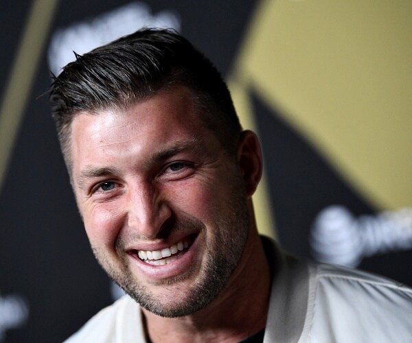 tim tebow smiles