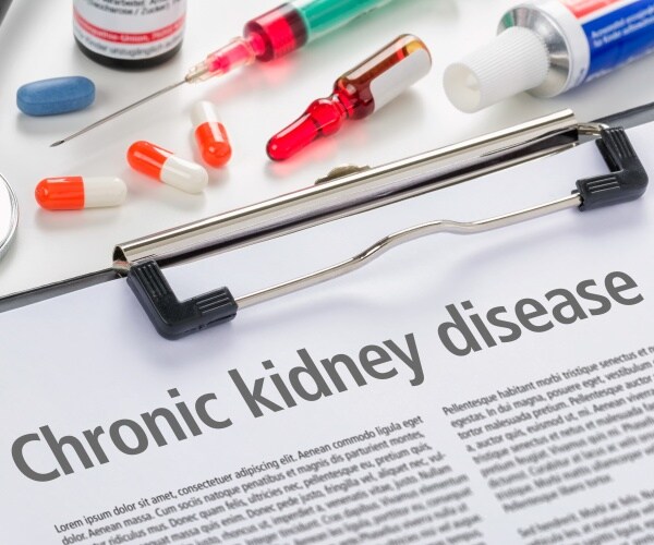 'Kidney Disease' surrounded by syringes and medications and a stethoscope