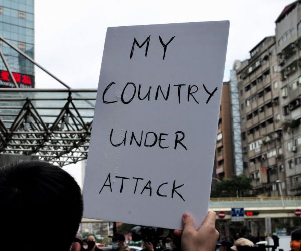 protester holding up a sign