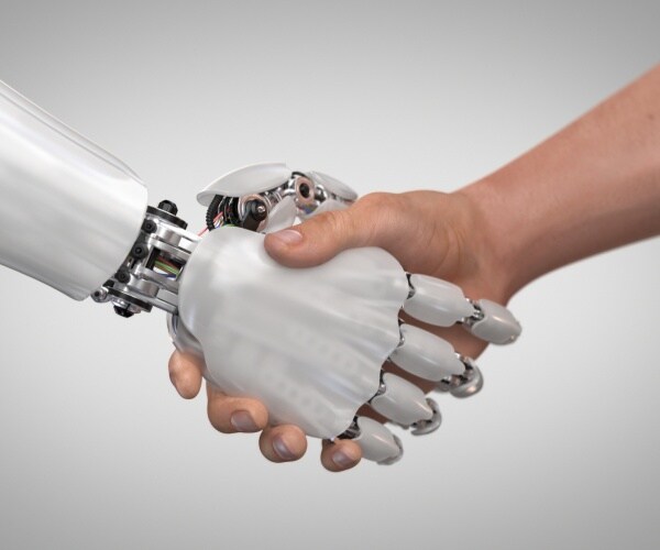 robot arm shakes hands with a human