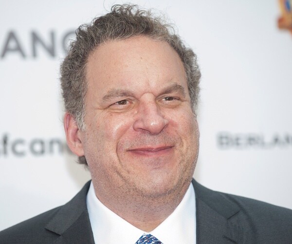 jeff garlin stands on red carpet