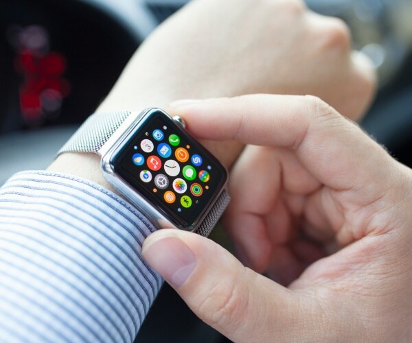 person with Apple watch on wrist