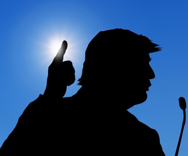 silhouette of donald trump in black with blue background