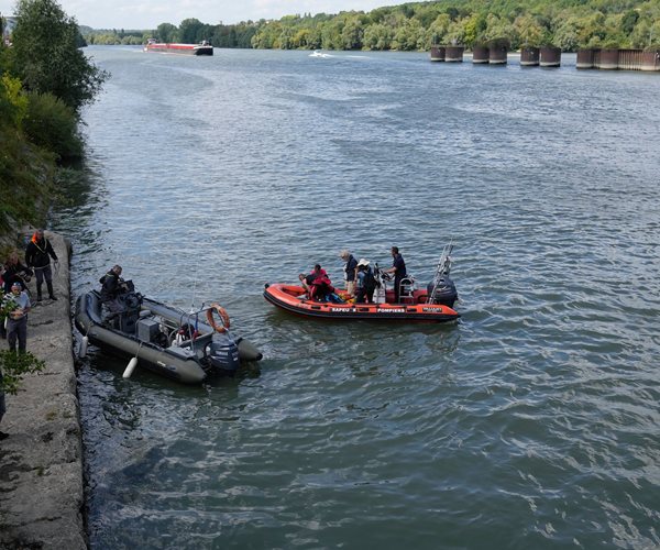 people on boats on the river