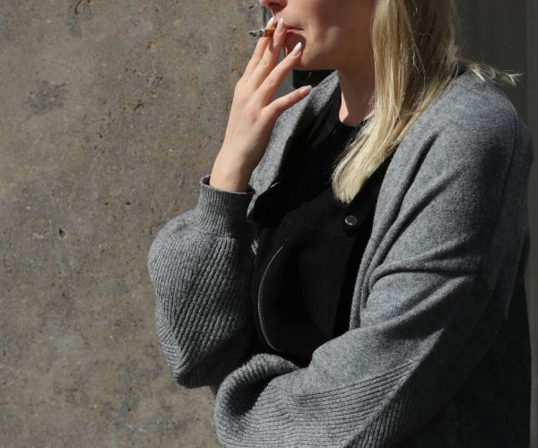 an office worker on a smoke break. 