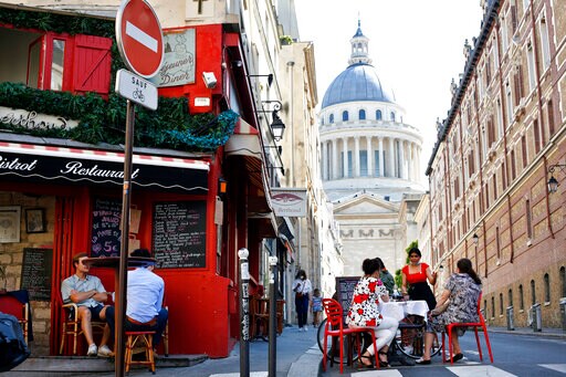 AP PHOTOS: Croissants and Hand Gel as Paris Cafes Reawaken
