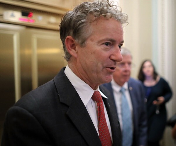 rand paul speaks with the media in the halls of congress