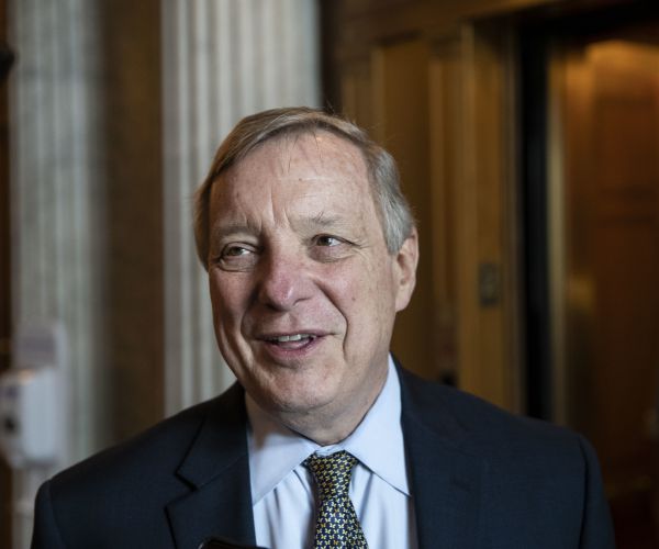 sen. dick durbin speaks with a reporter before the democratic policy luncheon on capitol hill. 