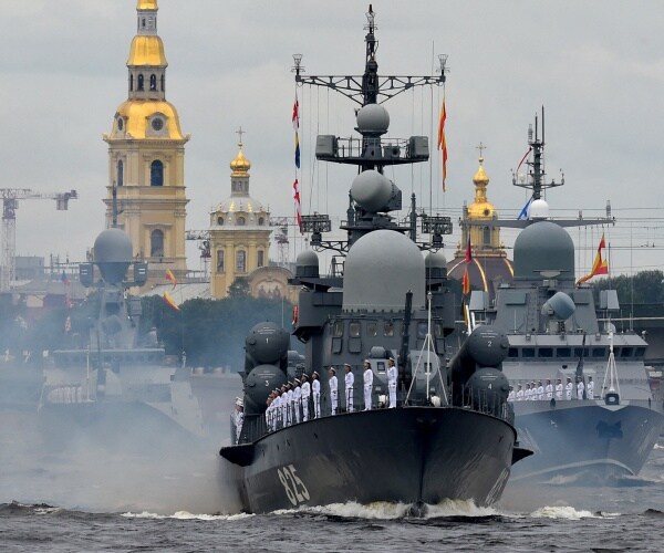 Soldiers stand at attention on a Russian Navy warship