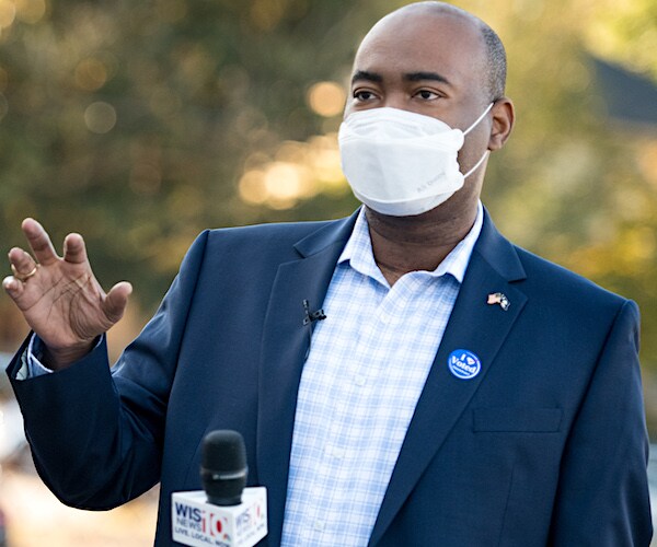 jaime harrison speaks during a news conference