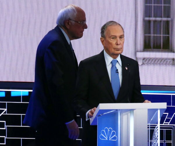 sen. bernie sanders and mike bloomberg take a break during the Democratic presidential primary debate