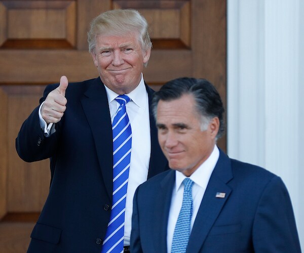 president donald trump gives a thumbs up with a smiling mitt romney in front of him