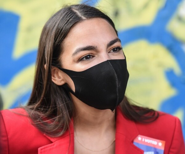 Alexandria Ocasio-Cortez  in a mask