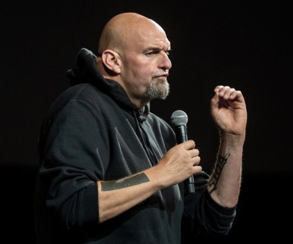 john fetterman speaks at a rally 